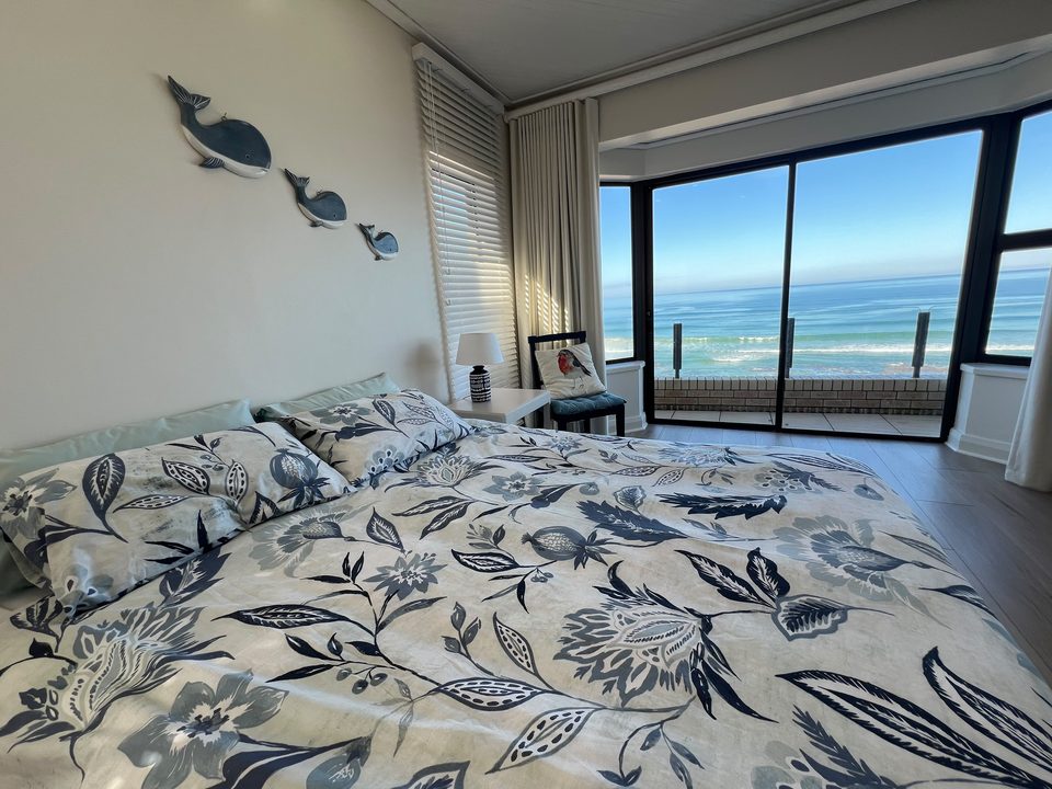 Main bedroom of the top unit with the ocean through the window